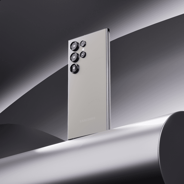 Silver flagship smartphone rendered against a moody light bar